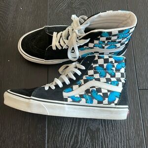 Vans high top with butterflies.